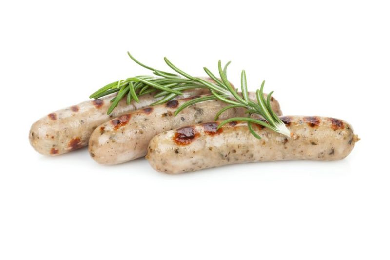 Grilled sausages with rosemary. Isolated on white background